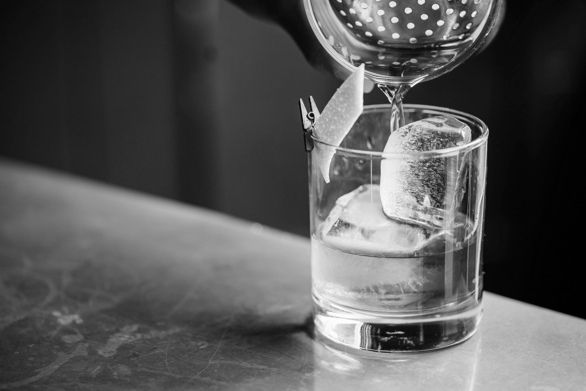 Pouring drink into a cup filled with ice