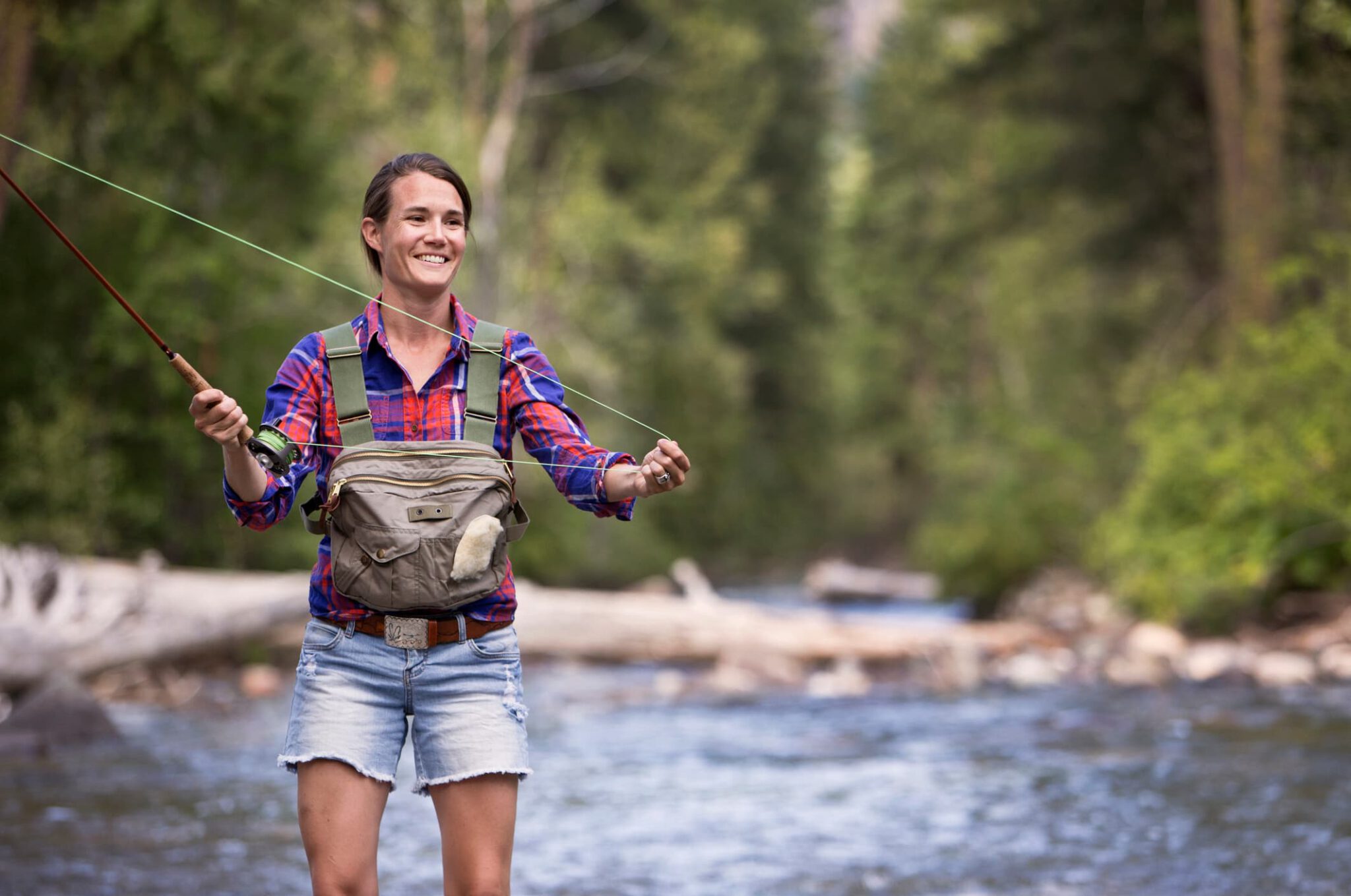 Woman fishing in a river