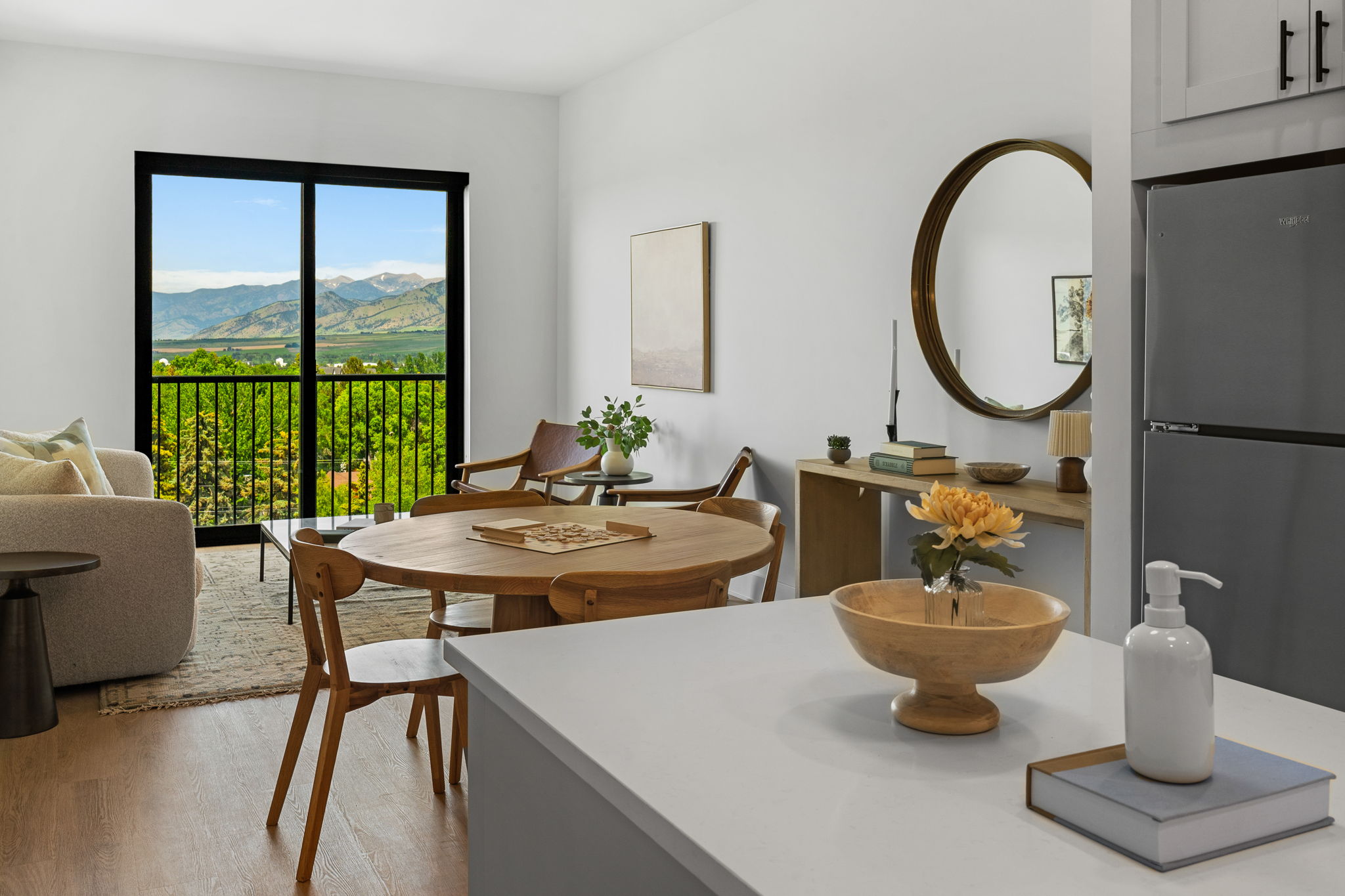 Freestone living room and kitchen counter with wood dining table and beautiful balcony view